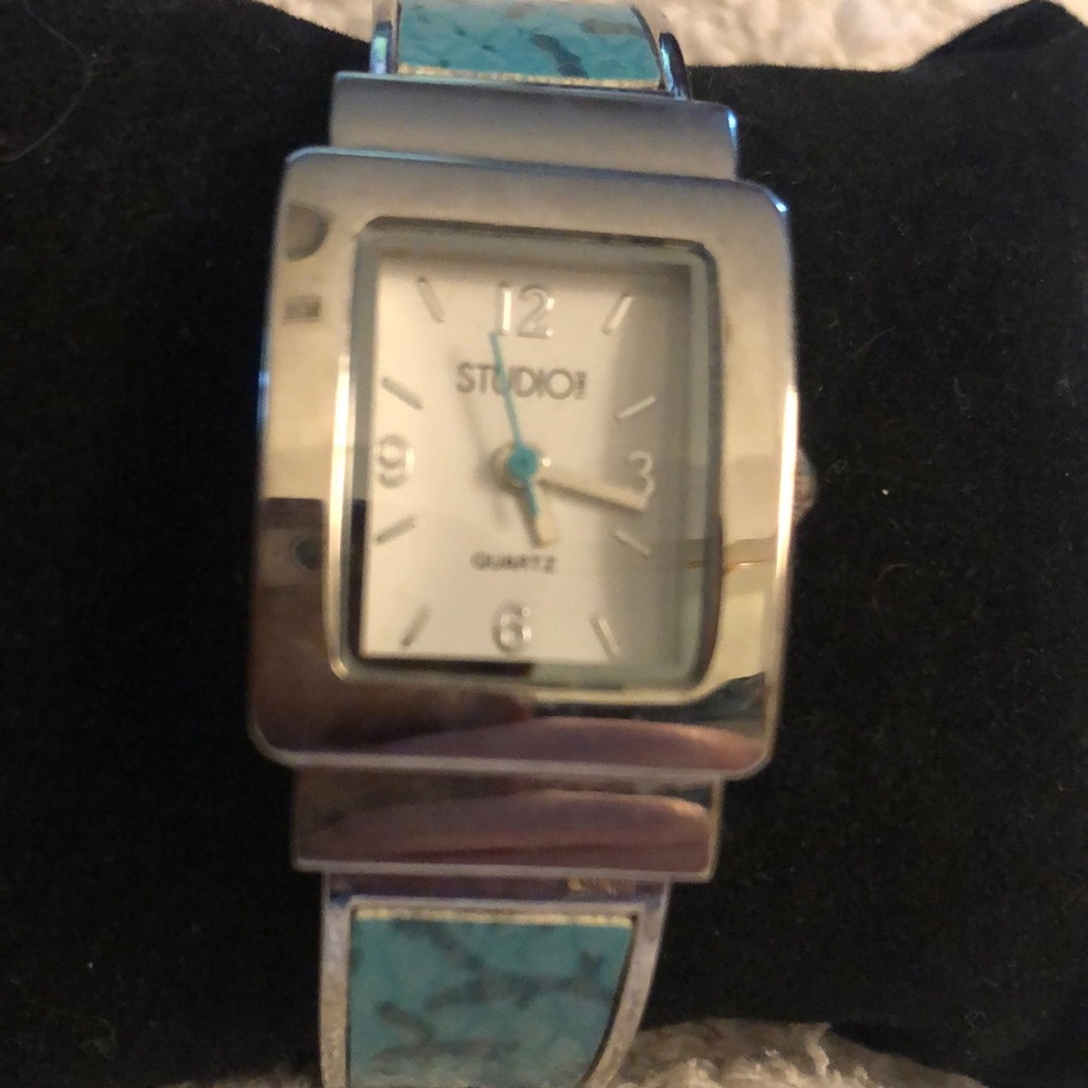 A Studio brand quartz watch with faux turquoise bracelet.